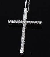Lot 2231 - A modern 9ct gold and diamond point set cross...