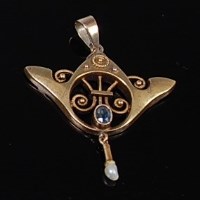 Lot 2244 - A German Art Nouveau yellow metal pendant, set...