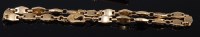 Lot 2268 - A Cartier 18ct gold bracelet, with safety...
