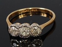 Lot 2301 - An 18ct gold and platinum diamond three stone...