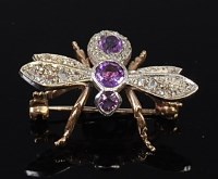Lot 2083 - A 9ct gold, amethyst and diamond set brooch in...