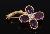 Lot 2084 - An 18ct gold, amethyst and diamond set flower...