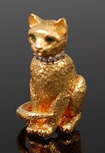 Lot 2095 - A Tiffany & Co. 18ct gold brooch as a seated...