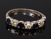 Lot 2100 - An 18ct white gold, sapphire and diamond set...