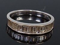 Lot 2173 - A modern 18ct white gold diamond half eternity...