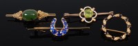 Lot 2185 - An 8ct gold and cabochon jade set bar brooch,...