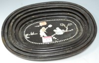 Lot 171 - A graduated set of five black lacquered and...