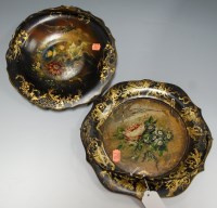 Lot 35 - A near pair of Victorian papier mache plates...