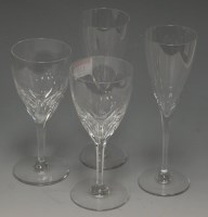 Lot 133 - A set of nine Baccarat glass champagne flutes,...