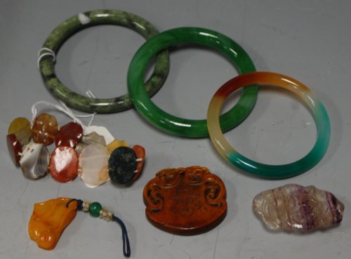 Lot 359 - Three Chinese jadeite bangles; together with...