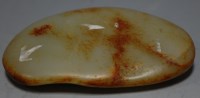 Lot 377 - A russet jade pebble, w.11cm