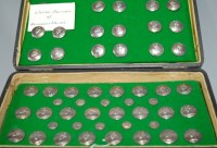 Lot 383 - A set of 52 white metal livery dress buttons,...