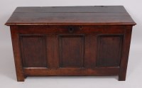 Lot 3631 - A George III joined oak coffer, the planked...