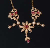 Lot 3265 - An Edwardian 18ct gold, ruby and seed pearl...