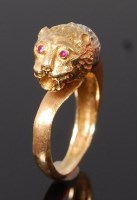 Lot 3283 - A modern 18ct gold, sapphire and ruby set...