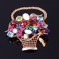 Lot 3296 - A 9ct gold multi-gem set basket brooch, set...