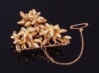 Lot 3298 - An 18ct gold, emerald and diamond set brooch,...