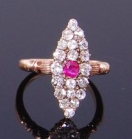 Lot 3306 - An Art Deco 18ct yellow gold, ruby and diamond...