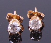 Lot 3307 - A pair of 14ct gold diamond ear studs, the...