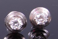 Lot 3310 - A pair of contemporary white metal diamond ear...