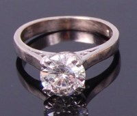 Lot 3323 - An 18ct white gold diamond solitaire ring, the...