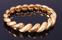 Lot 3330 - A contemporary 18ct yellow gold bracelet,...