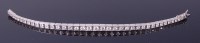Lot 3331 - An 18ct white gold and diamond set tennis...