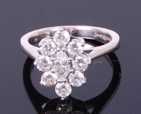Lot 3344 - An 18ct white gold diamond flower head cluster...