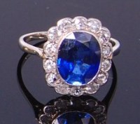 Lot 3347 - A white metal, sapphire and diamond set ring,...