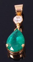 Lot 3353 - An 18ct gold, emerald and diamond drop pendant,...