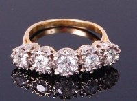 Lot 3368 - A yellow metal diamond five stone ring, of...