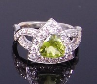 Lot 3370 - A contemporary 14ct white gold, green peridot...