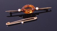 Lot 3375 - A 15ct gold, topaz and seed pearl set...