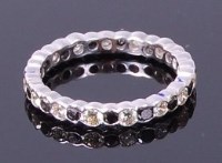 Lot 3382 - A 14ct white gold diamond eternity ring,...