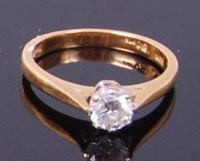 Lot 3385 - An 18ct gold diamond solitaire ring, the claw...