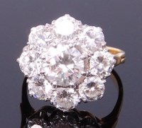 Lot 3393 - An 18ct gold diamond flower head cluster ring,...