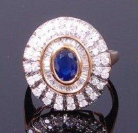 Lot 3400 - A modern 18ct gold, sapphire and diamond dress...