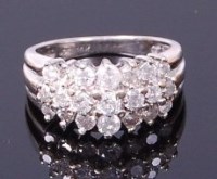 Lot 3405 - A 14ct white gold diamond dress ring, arranged...