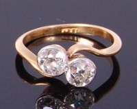 Lot 3407 - An Edwardian 18ct gold and diamond crossover...