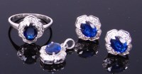 Lot 3415 - A contemporary 9ct white gold, sapphire and...