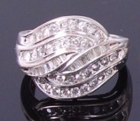 Lot 3416 - A modern 9ct white gold and diamond dress ring,...