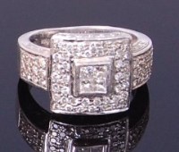 Lot 3419 - An Art Deco platinum and diamond set dress...