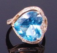 Lot 3420 - A contemporary 14ct gold, topaz and diamond...