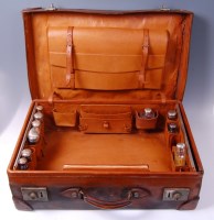 Lot 3481 - A circa 1900 brown leather travel case,...