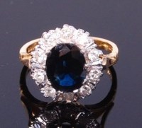Lot 3304 - An 18ct gold, sapphire and diamond cluster...