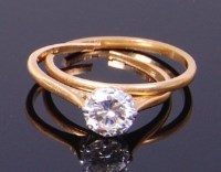 Lot 3327 - An 18ct gold diamond solitaire ring, the claw...