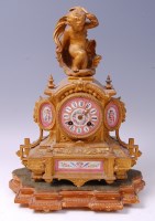 Lot 3596 - A 19th century French gilt metal and porcelain...