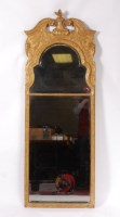 Lot 3609 - A George II giltwood and gesso pier glass, the...