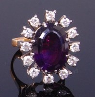 Lot 3424 - An 18ct gold, amethyst and diamond dress ring,...