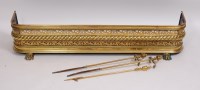 Lot 3638 - A Regency pierced brass D-shaped fender,...